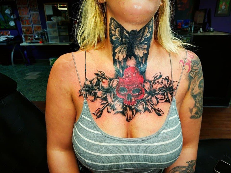 a skull in center with flowers