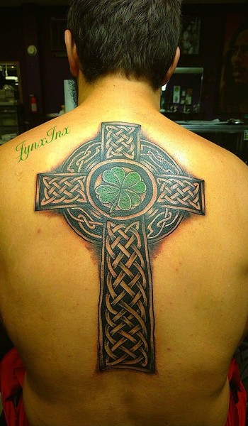 a cross with a clover in the center