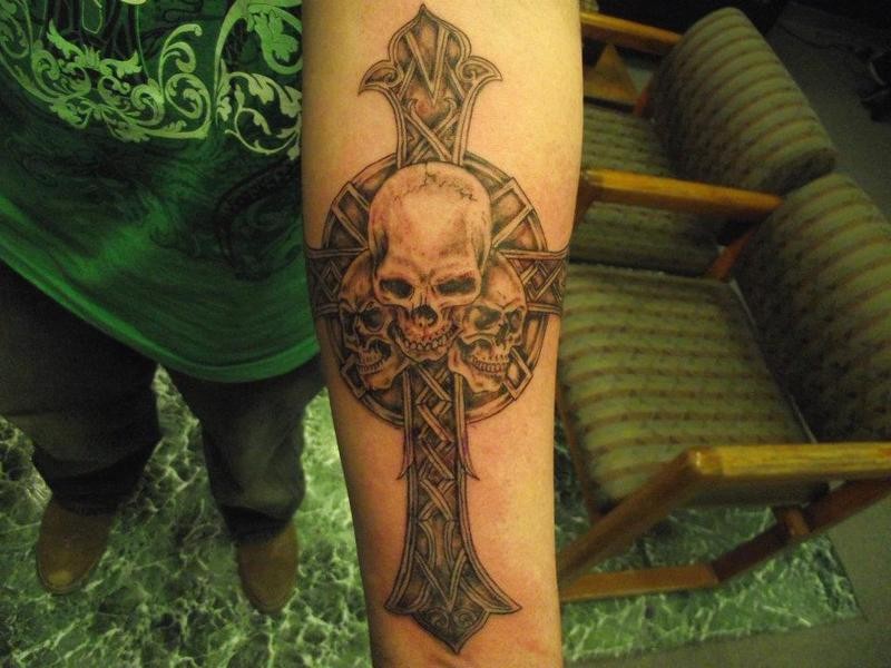 cross with a skull in the middle