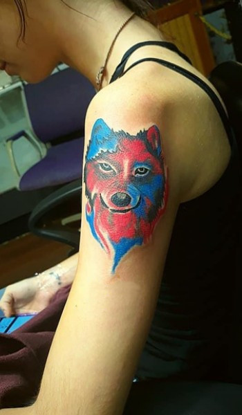 wolf figure in blue and red